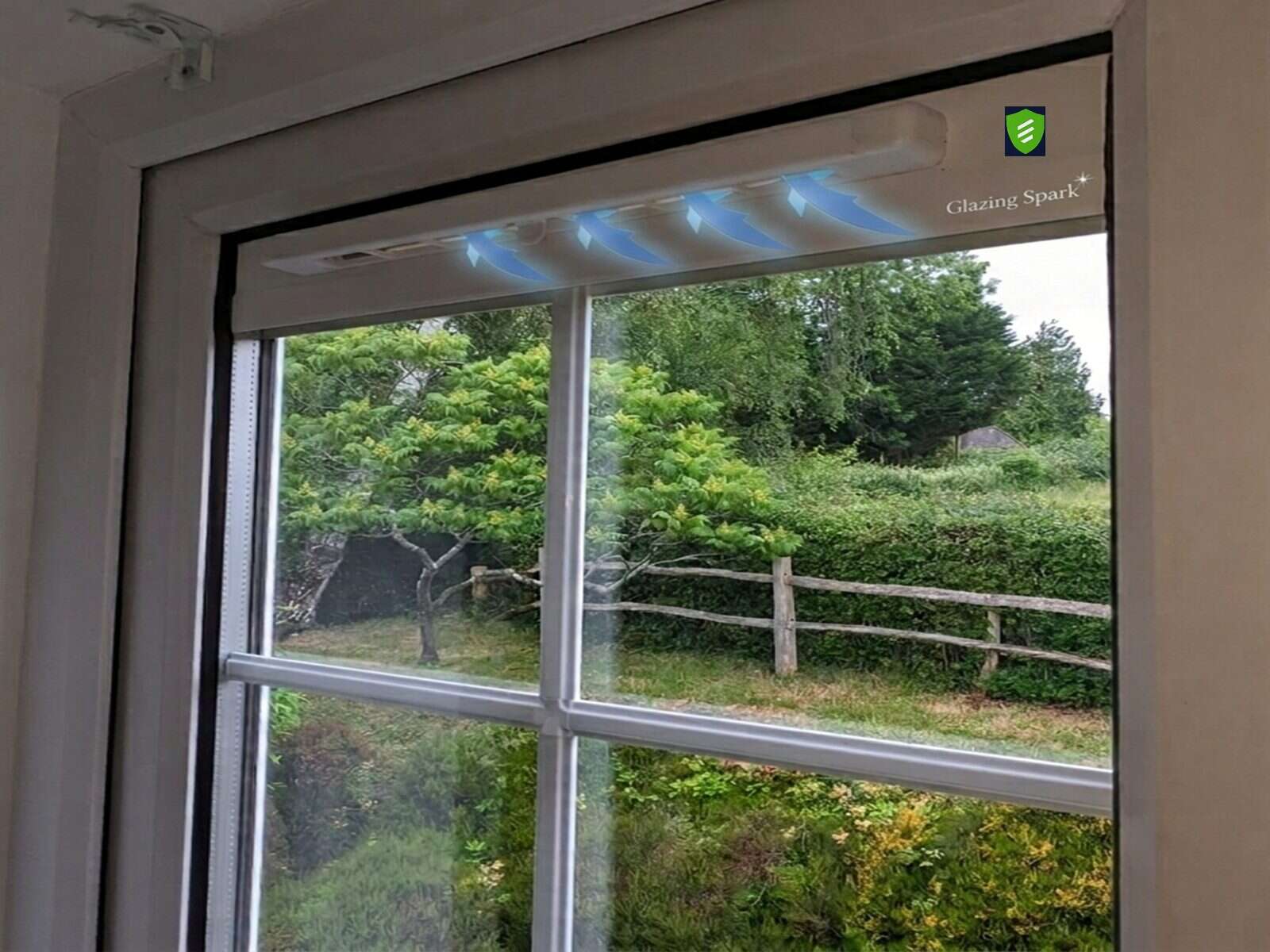 Close-up of a retrofit Glass Vent drawing background airflow into a room overlooking countryside