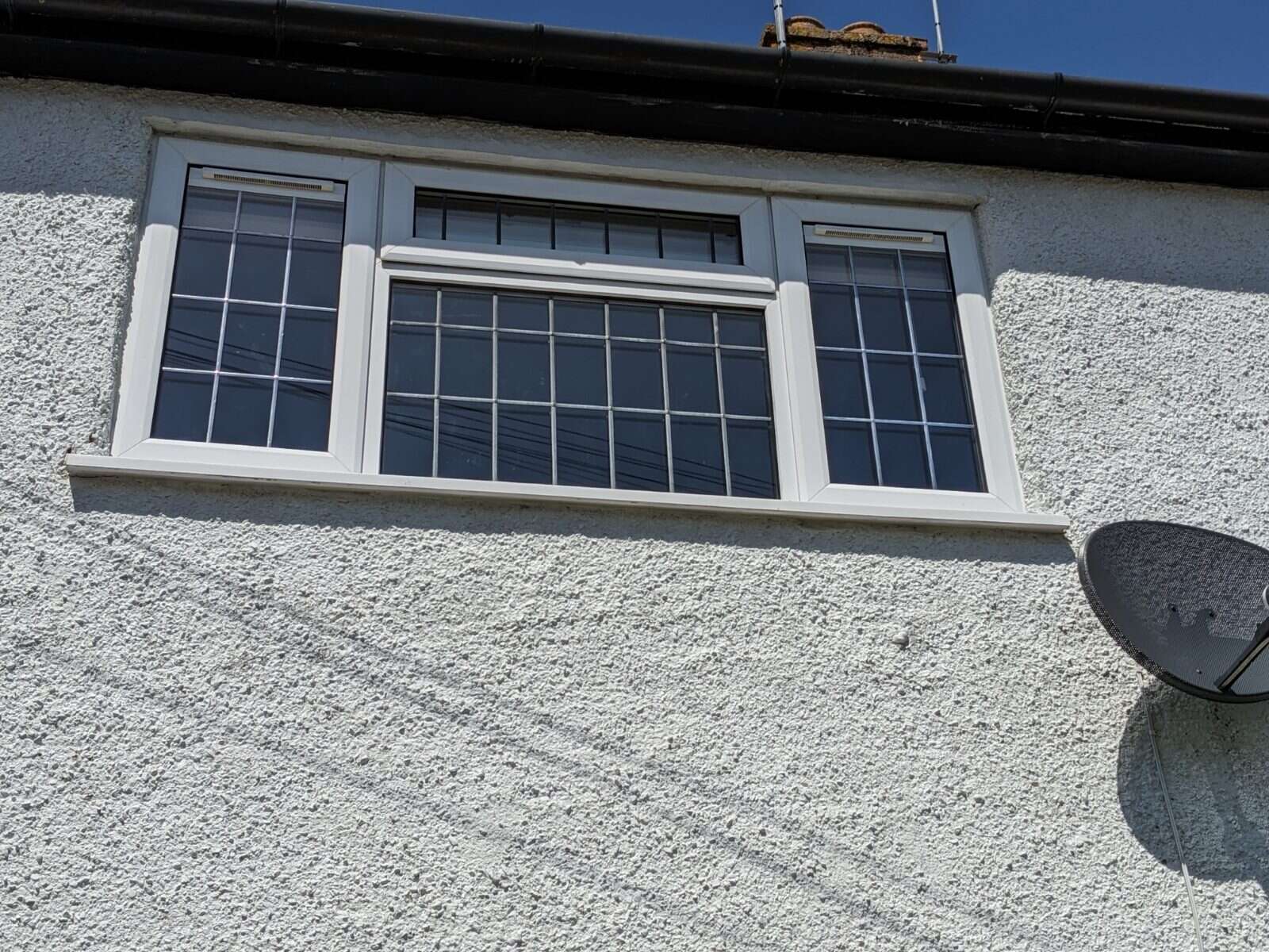 Retrofit Glass Vent fitted to a window with a rural outlook