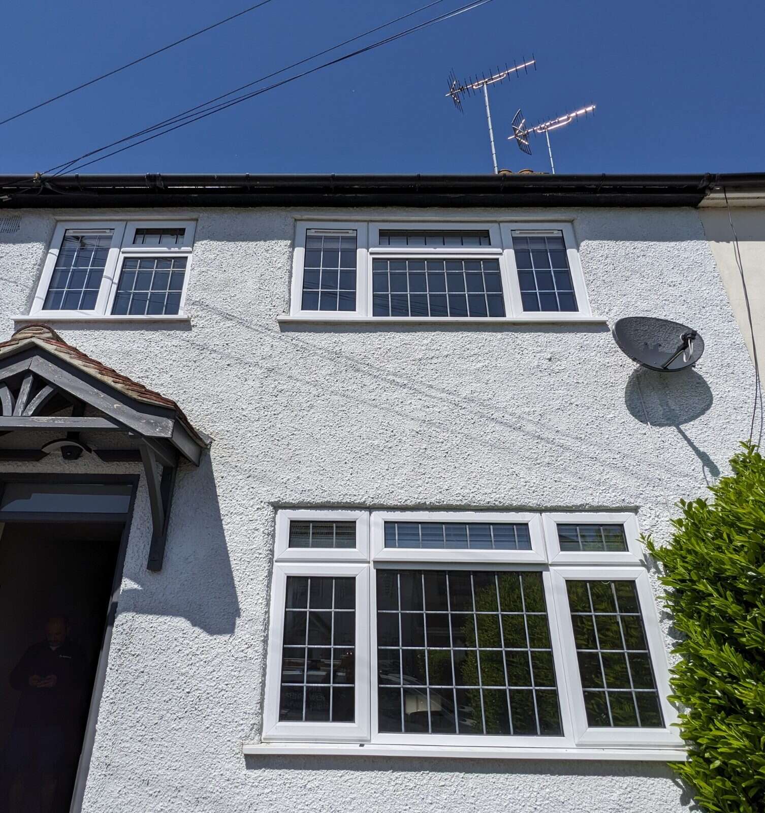 White rendered home with leaded windows fitted with discreet Glass Vents