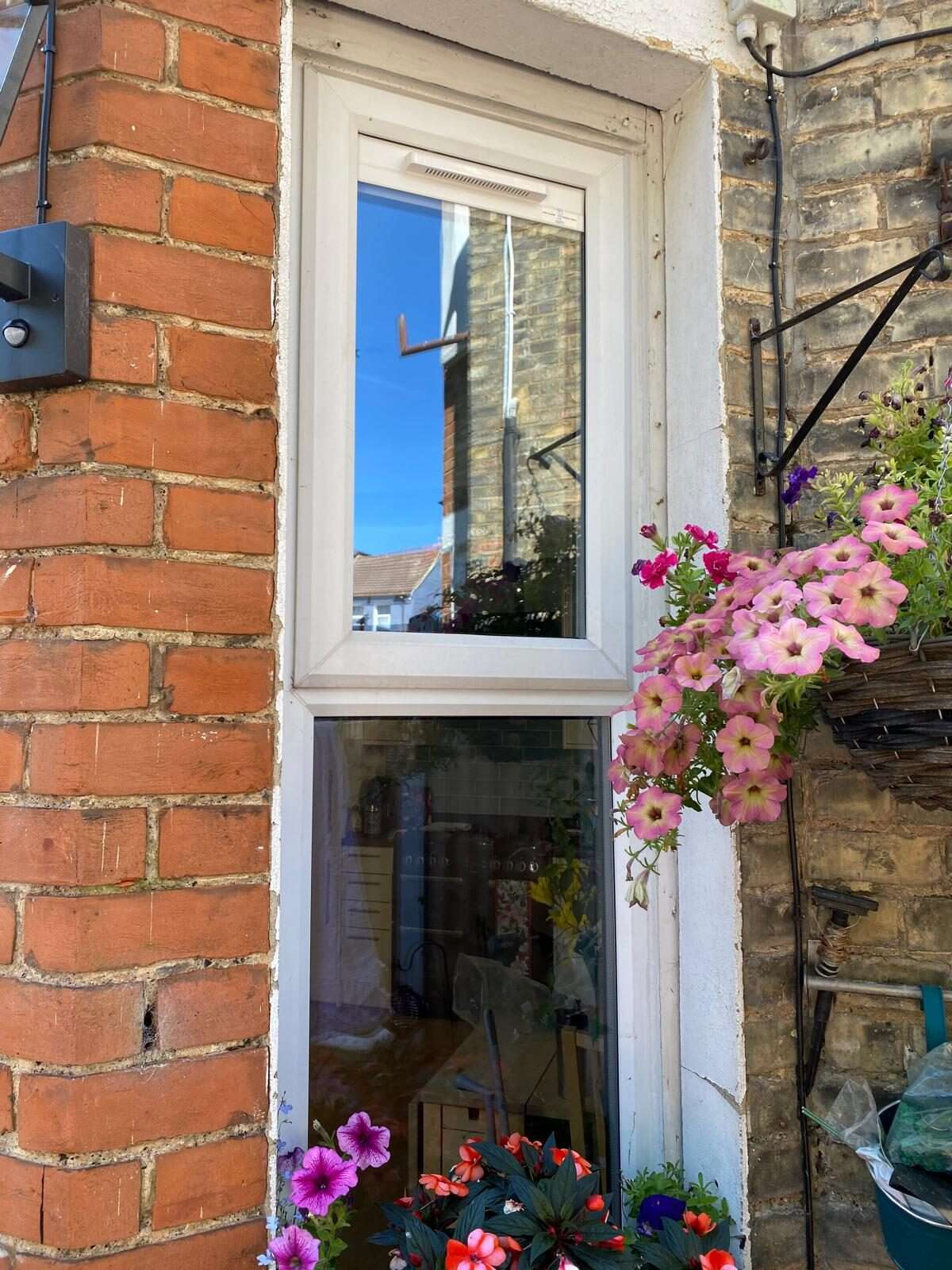 Rendered semi-detached home with discreet top-rail Glass Vents